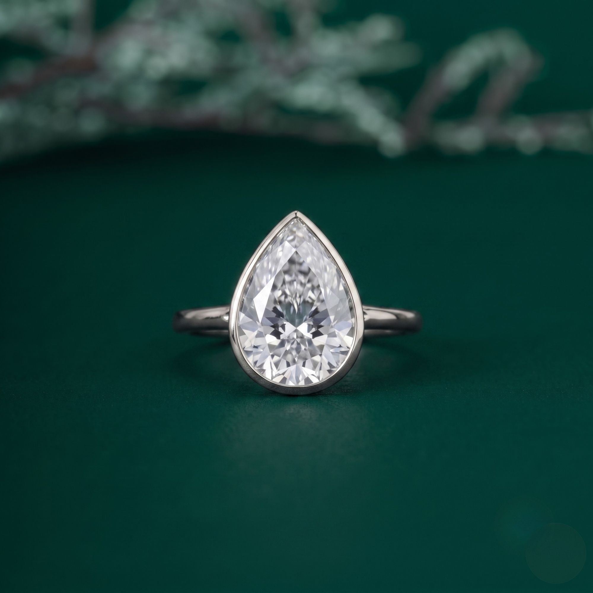 Pear solitaire engagement ring with solitaire pear ring.
