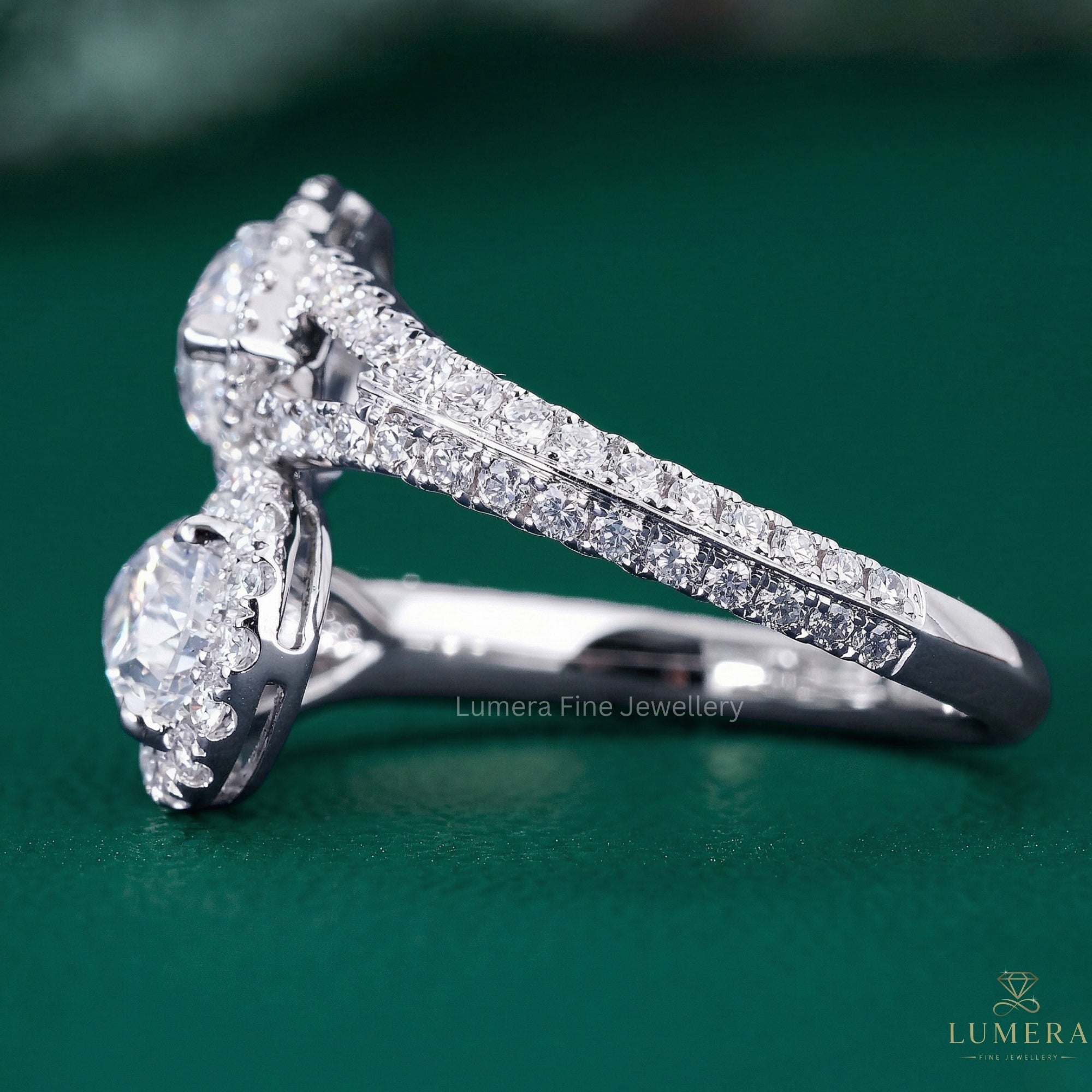 pear diamond ring with bypass style ring.