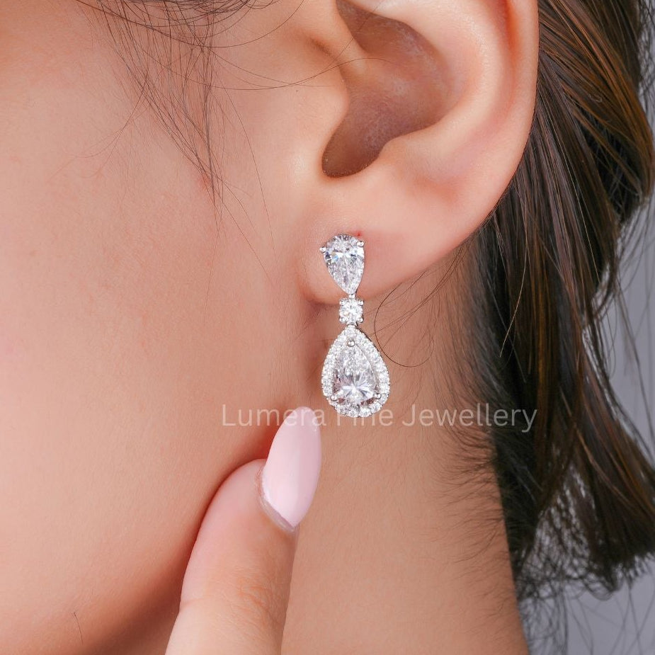 pear earrings with round diamond earrings.
