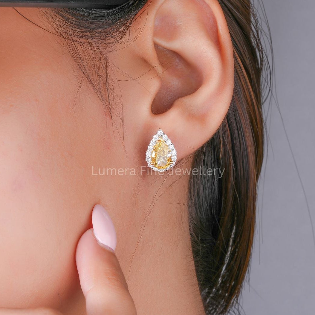 yellow diamond earrings with diamond stud earrings.
