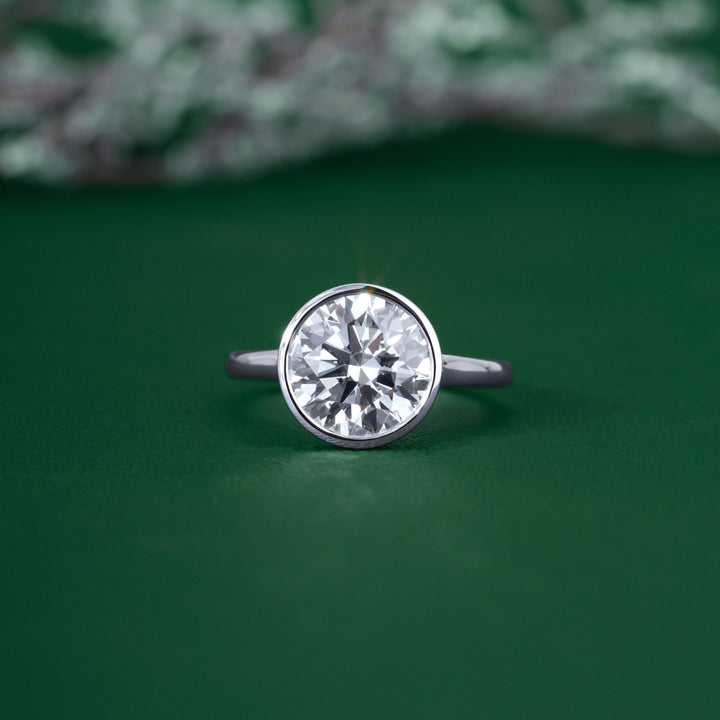 Round cut solitaire engagement ring with round cut diamond engagement ring.