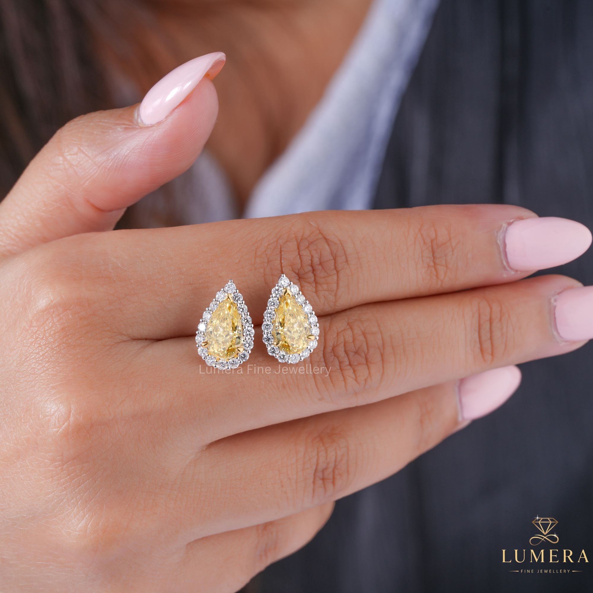 pear shaped diamond earrings with halo earrings.
