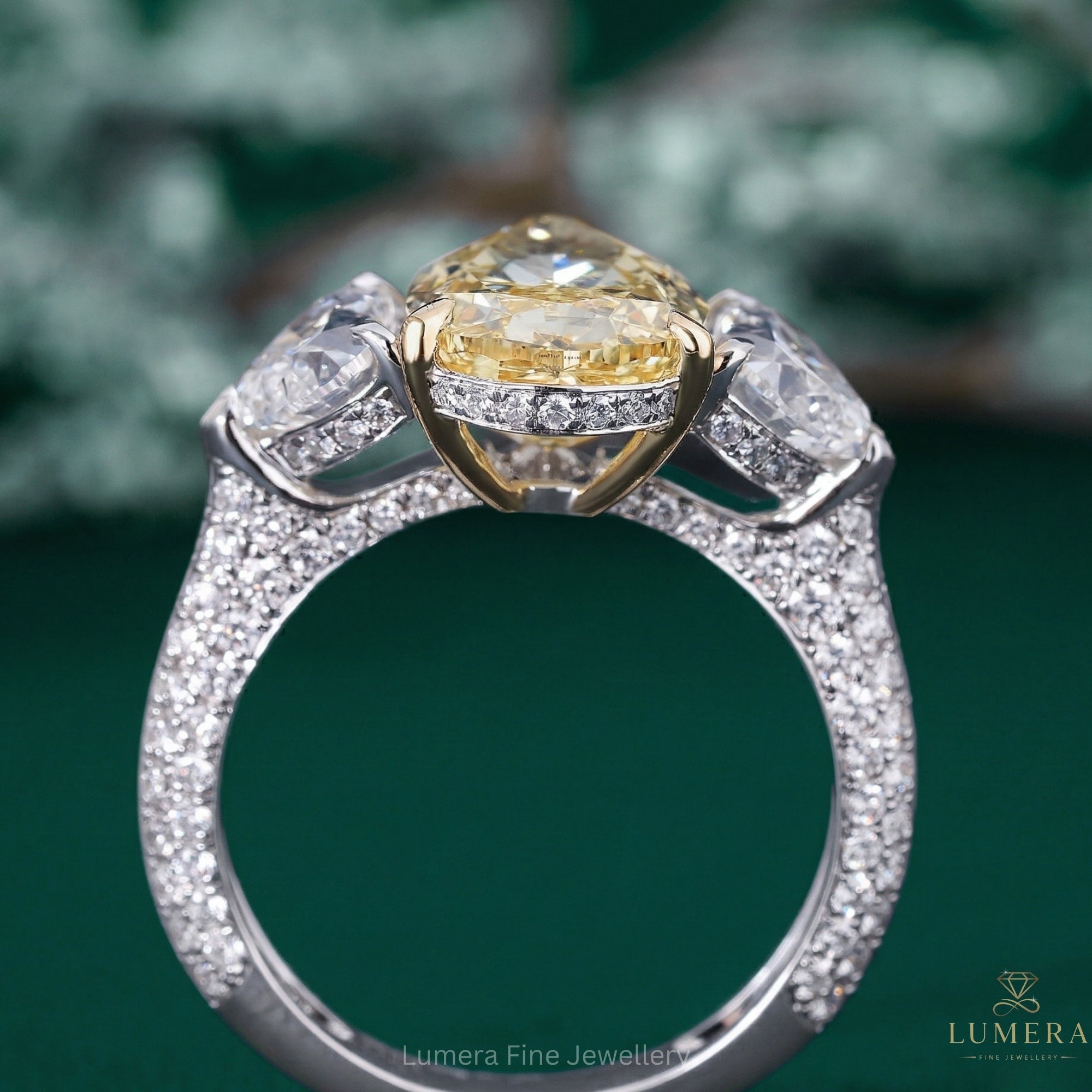 pear diamond ring with 3 stone engagement ring.