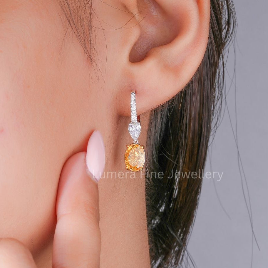 drop hoop earrings with round diamond earrings.
