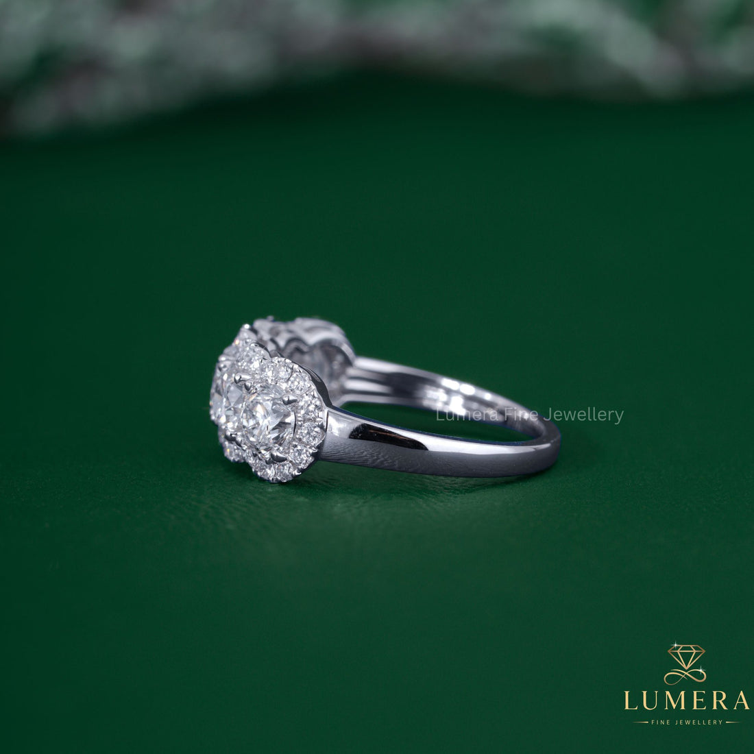 Halo diamond band with 4 prong setting.