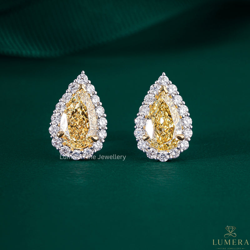 yellow diamond earrings with pear shaped diamond earrings.
