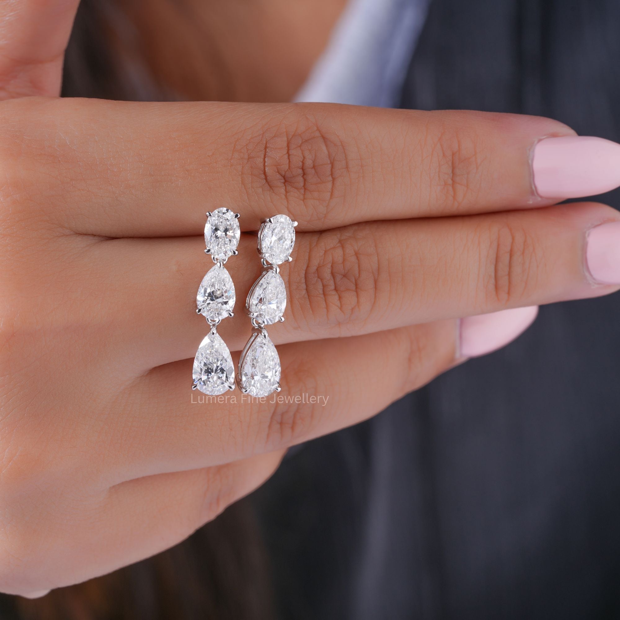 oval diamond earrings with claw prong set.
