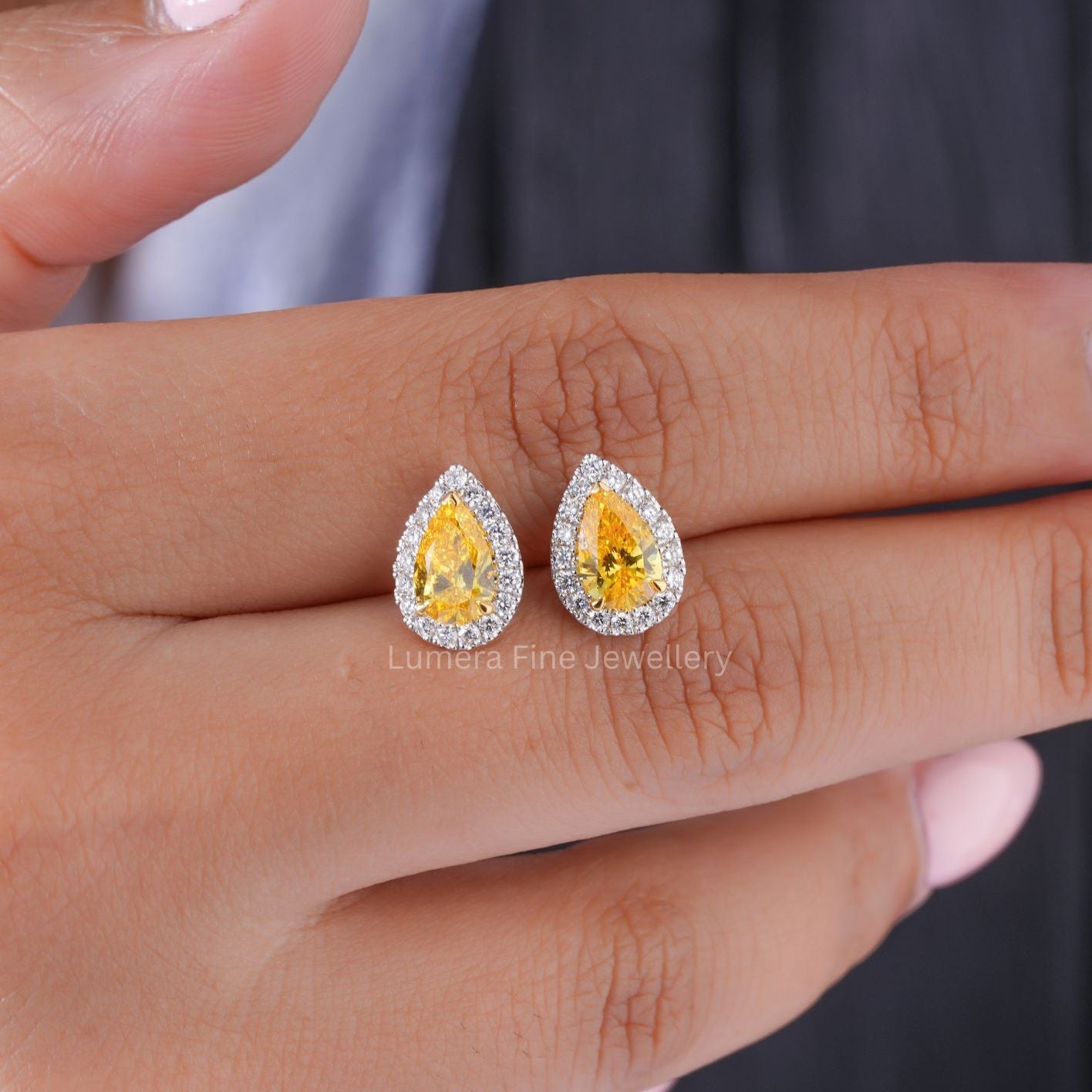 two tone gold earrings with fancy stud earrings.
