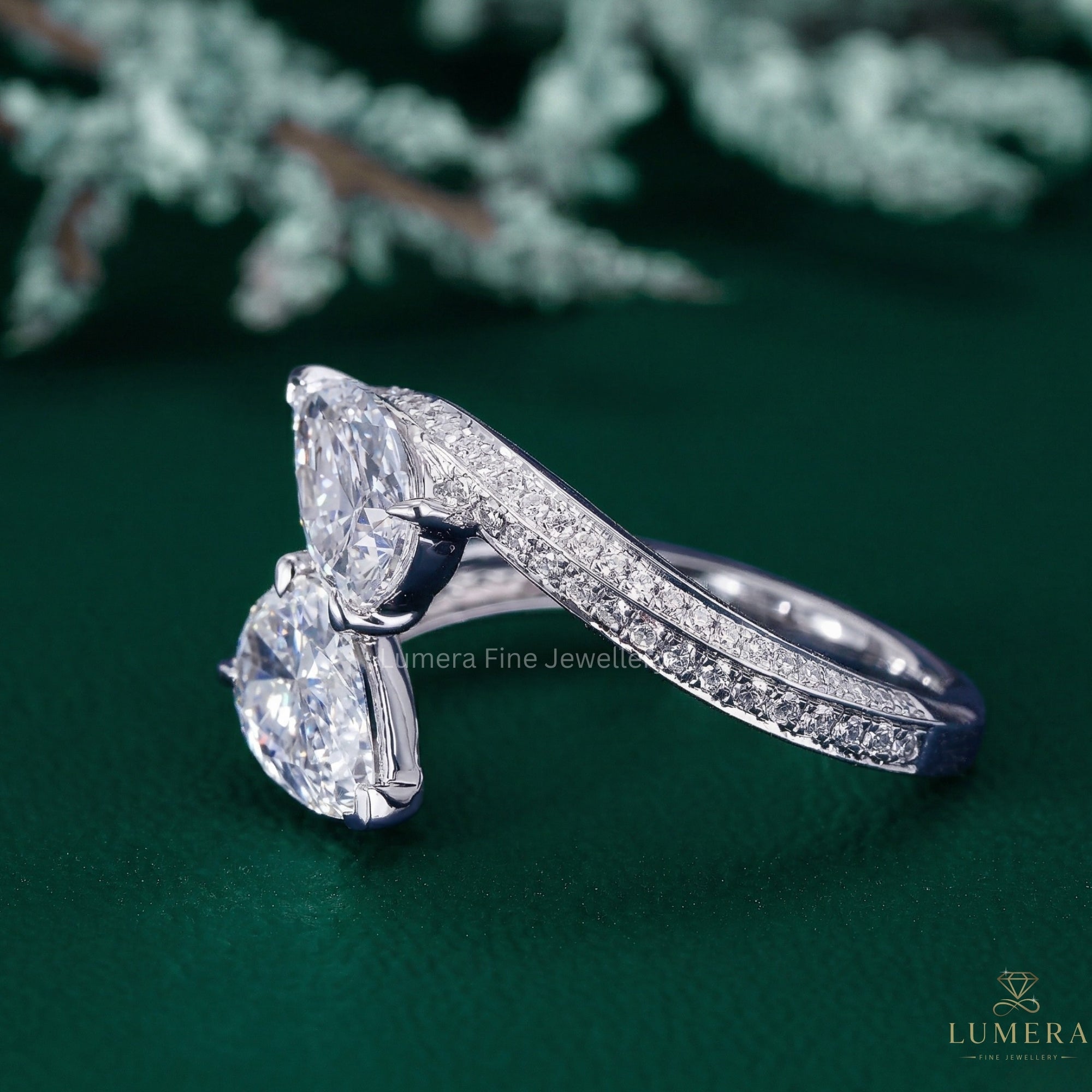 pear shaped engagement ring with two stone ring.