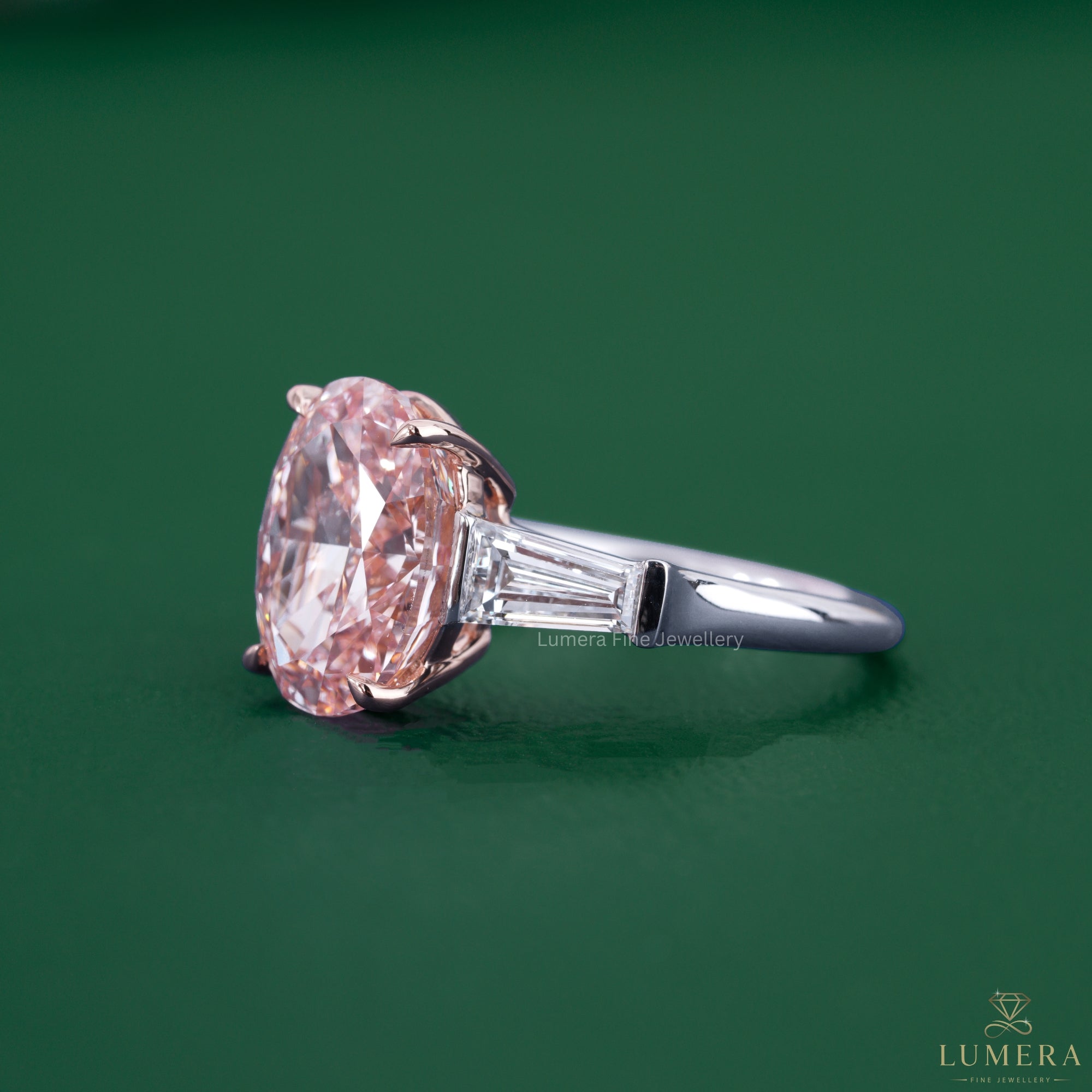 3 diamond ring with a tapered baguette side stone.