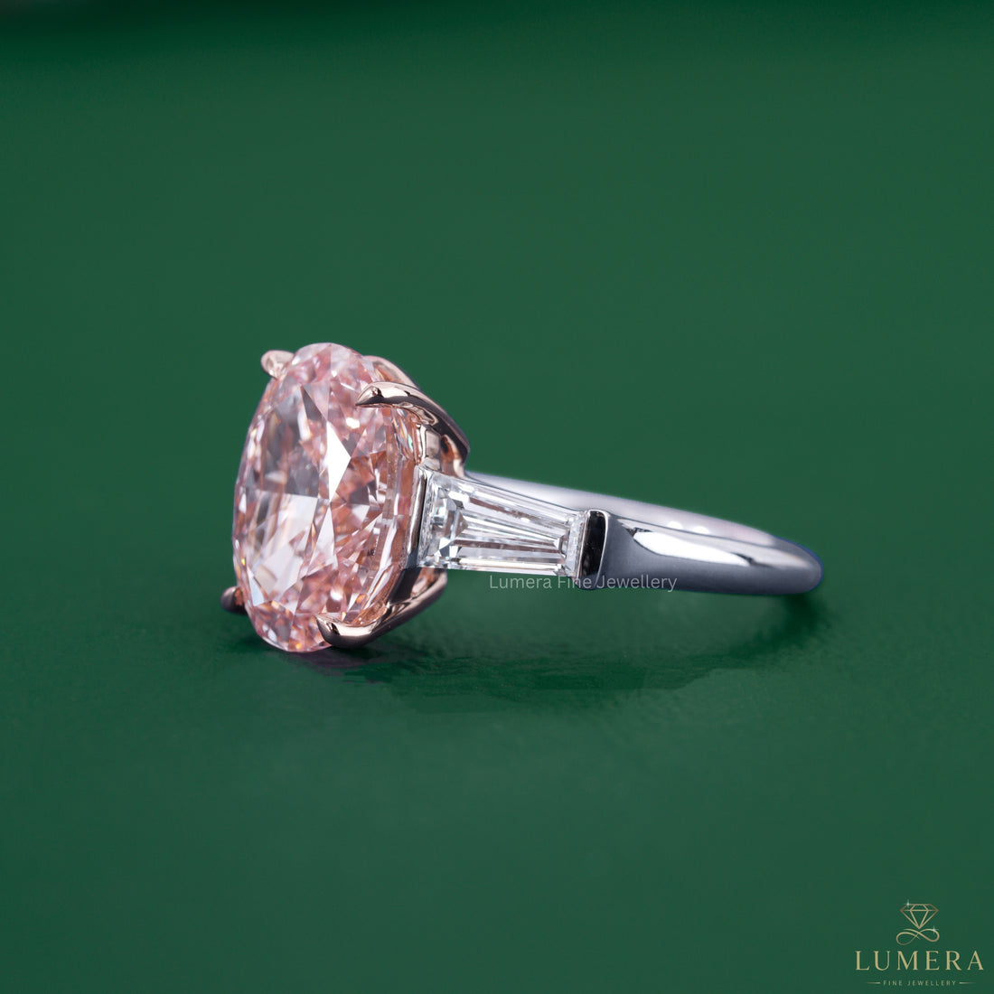 3 diamond ring with a tapered baguette side stone.