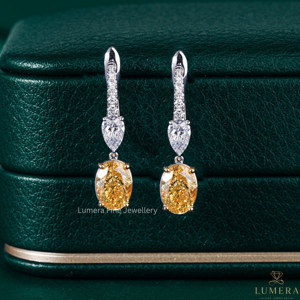 oval diamond earrings with oval cut hoop earrings.
