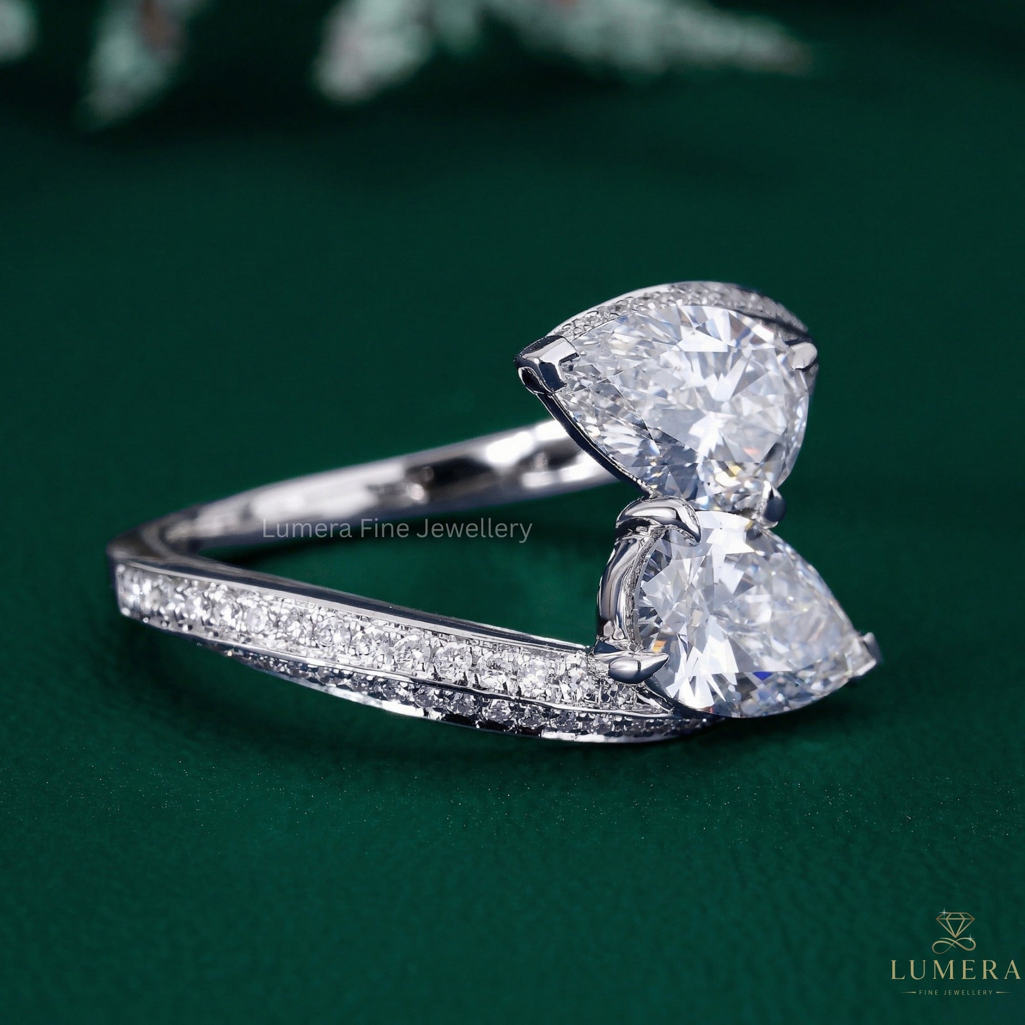 two stone pear diamond ring with almond shape diamond ring.