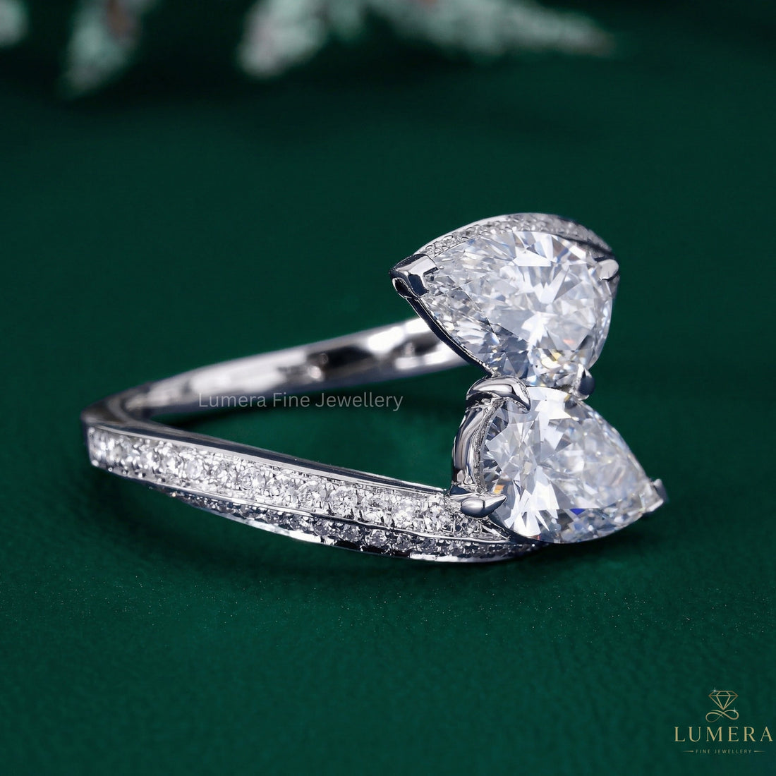 two stone pear diamond ring with almond shape diamond ring.