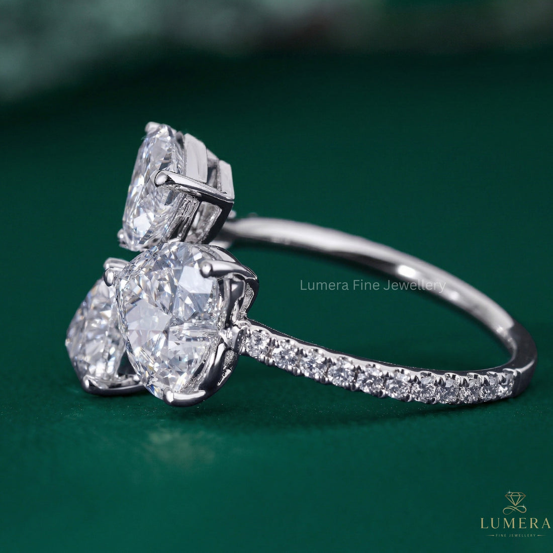 heart ring with three stone diamond ring.