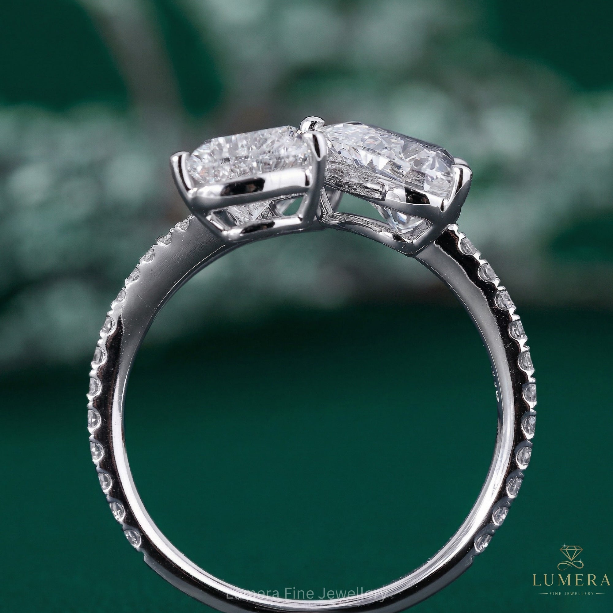 3 stone engagement ring with branch ring.