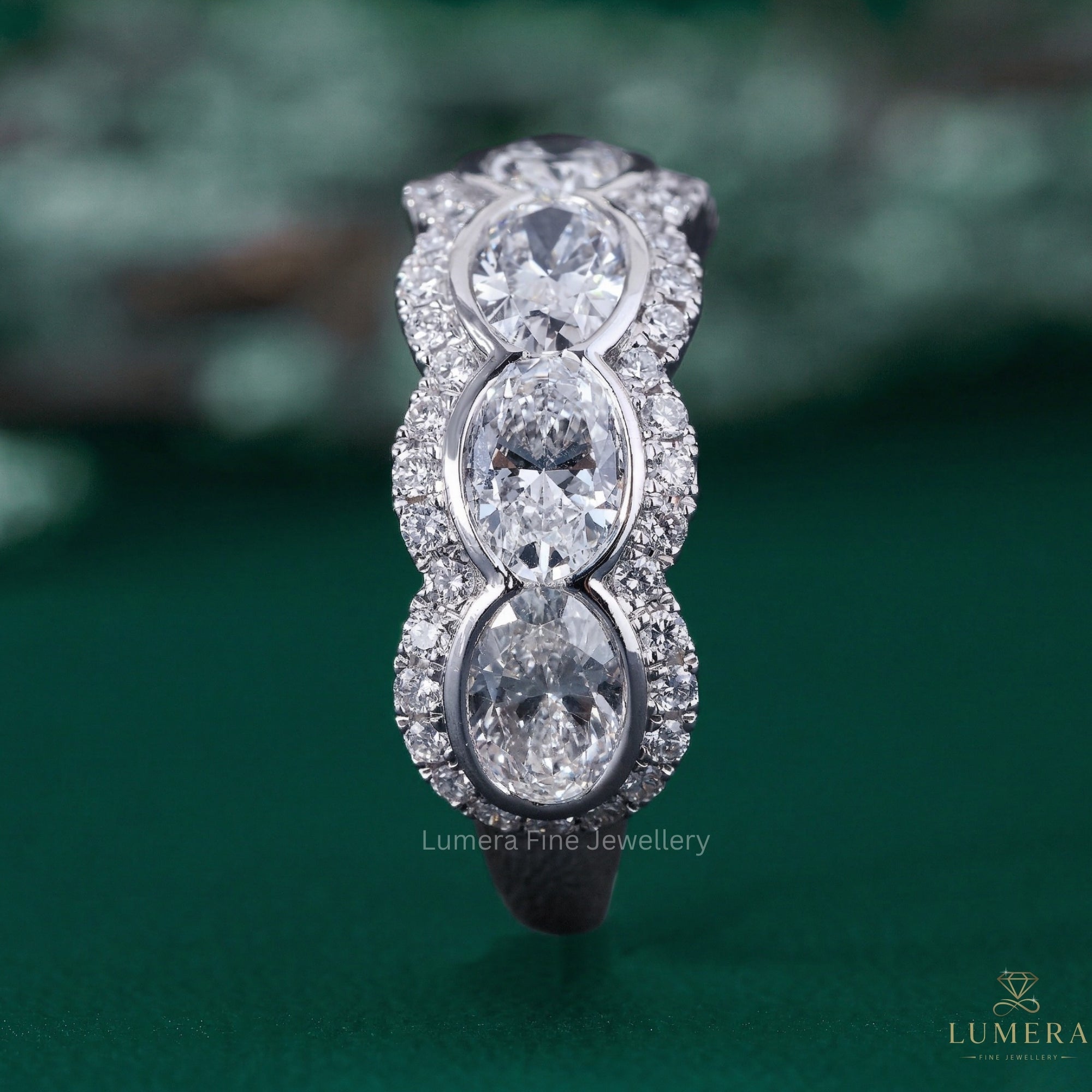 oval diamond wedding band with bezel setting.
