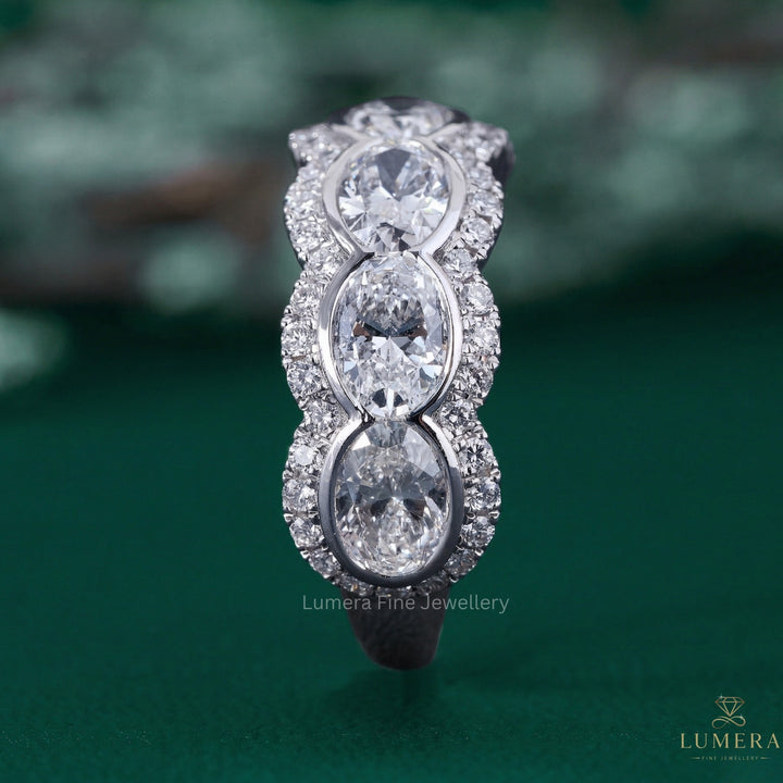 oval diamond wedding band with bezel setting.
