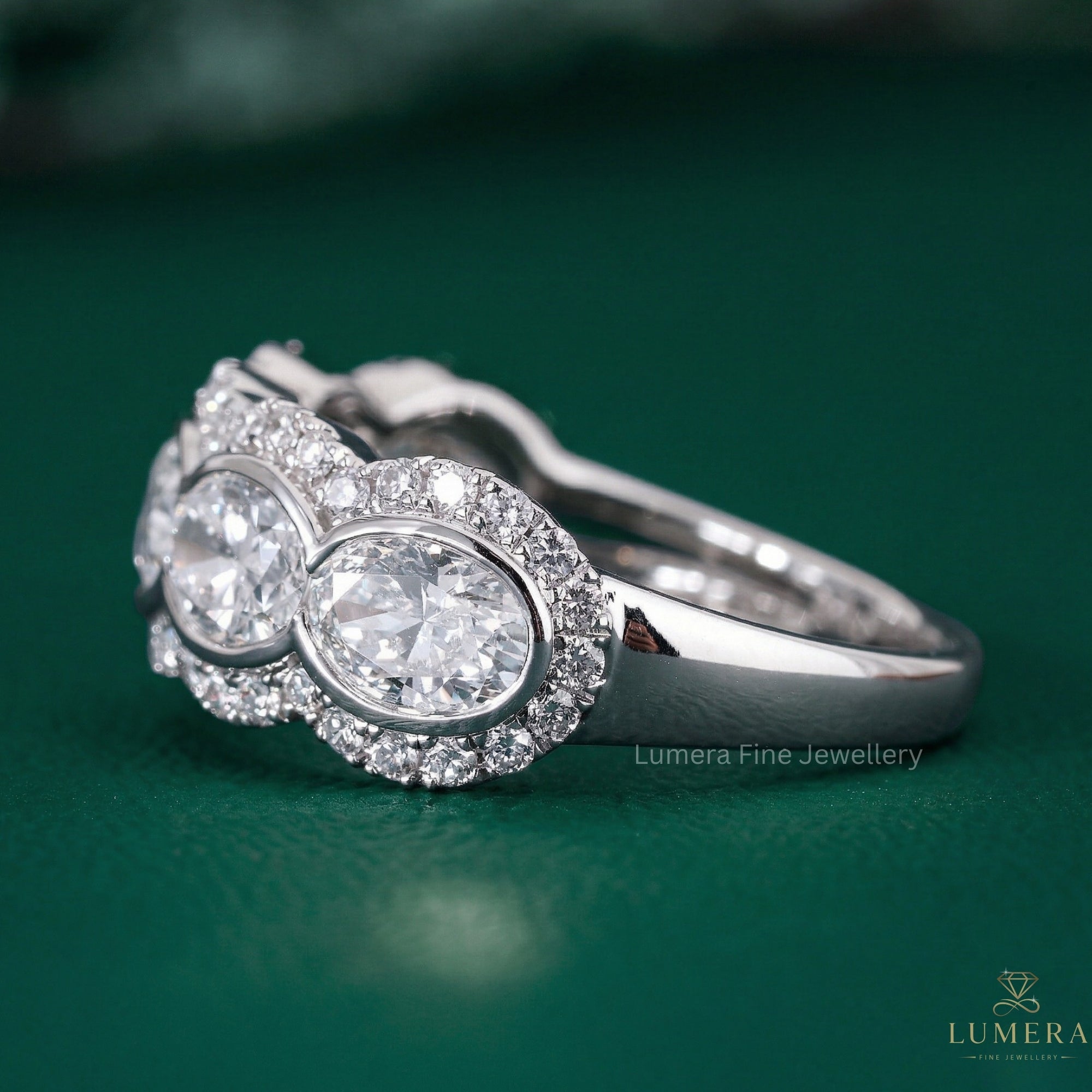 oval bezel wedding band with east west oval diamond.
