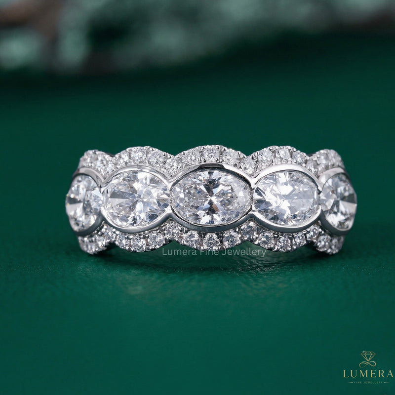 oval wedding band with scalloped oval diamond band.
