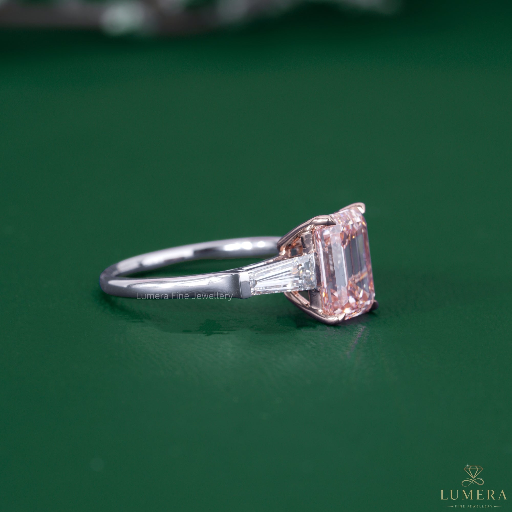 Pink diamond ring paired with a rose and white gold ring.