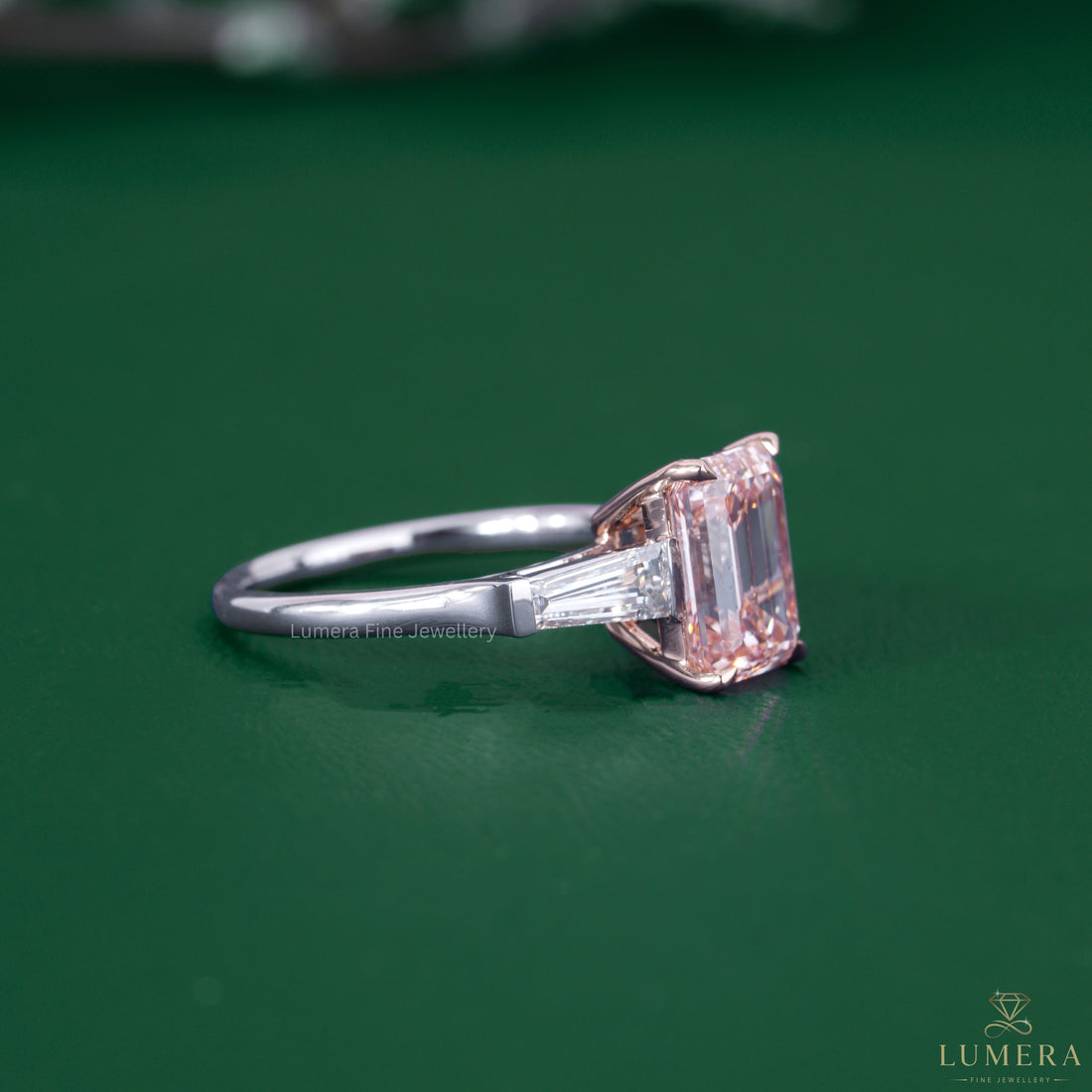 Pink diamond ring paired with a rose and white gold ring.
