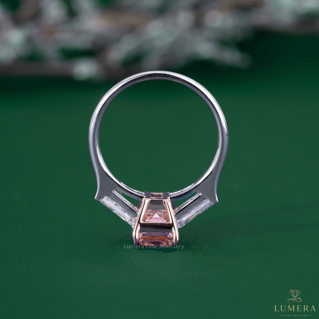 Three stone engagement ring styled with tapered baguette stones.