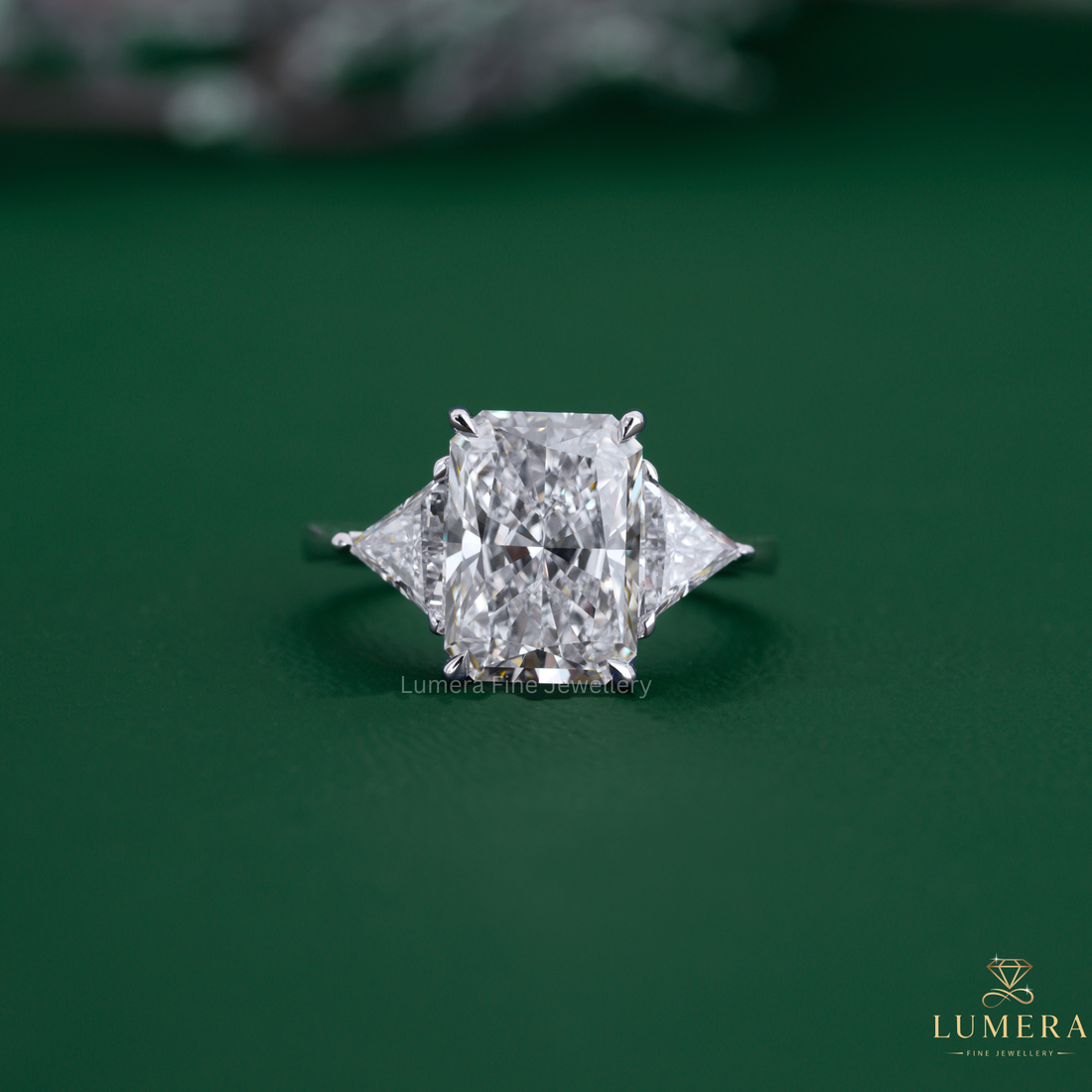 Radiant diamond engagement ring with three stone engagement ring.