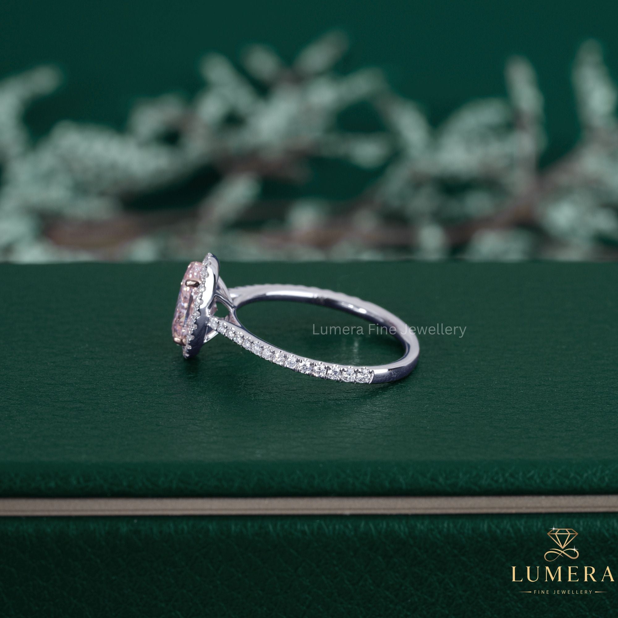 Pink diamond ring paired with a cathedral setting ring.