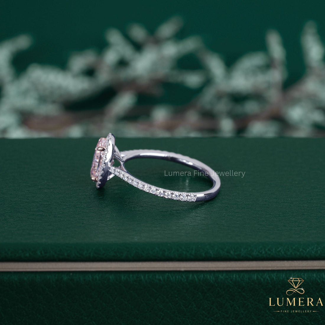 Pink diamond ring paired with a cathedral setting ring.