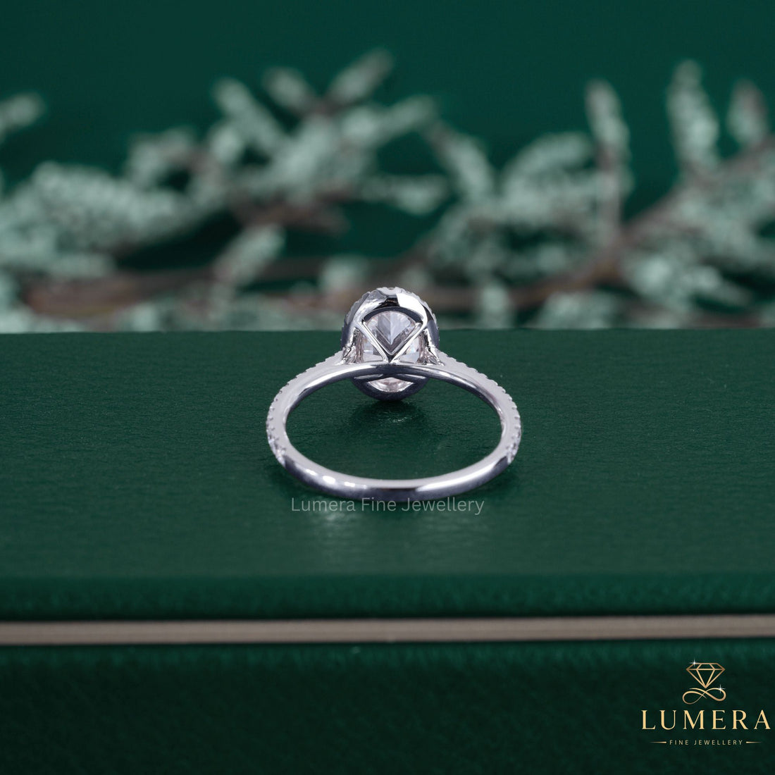 Oval diamond ring featuring a halo engagement ring.
