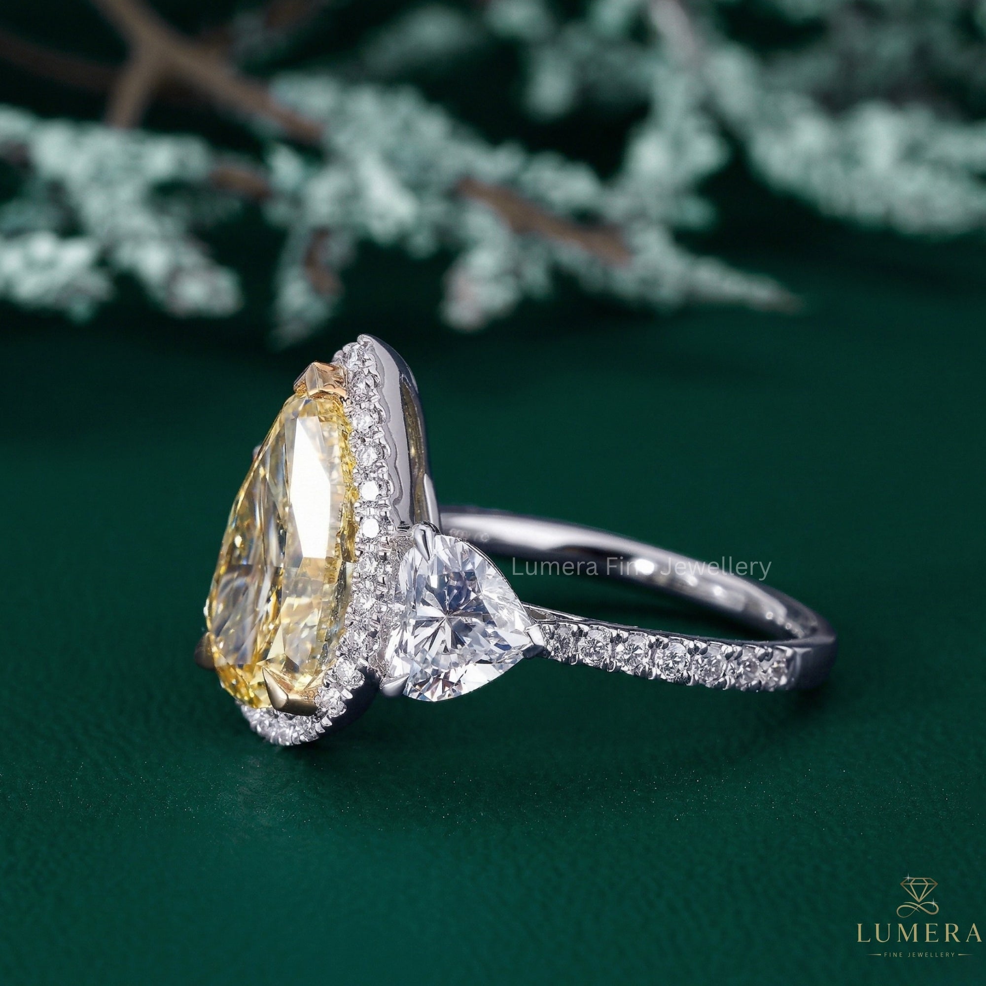 pear diamond engagement ring with yellow pear diamond ring.