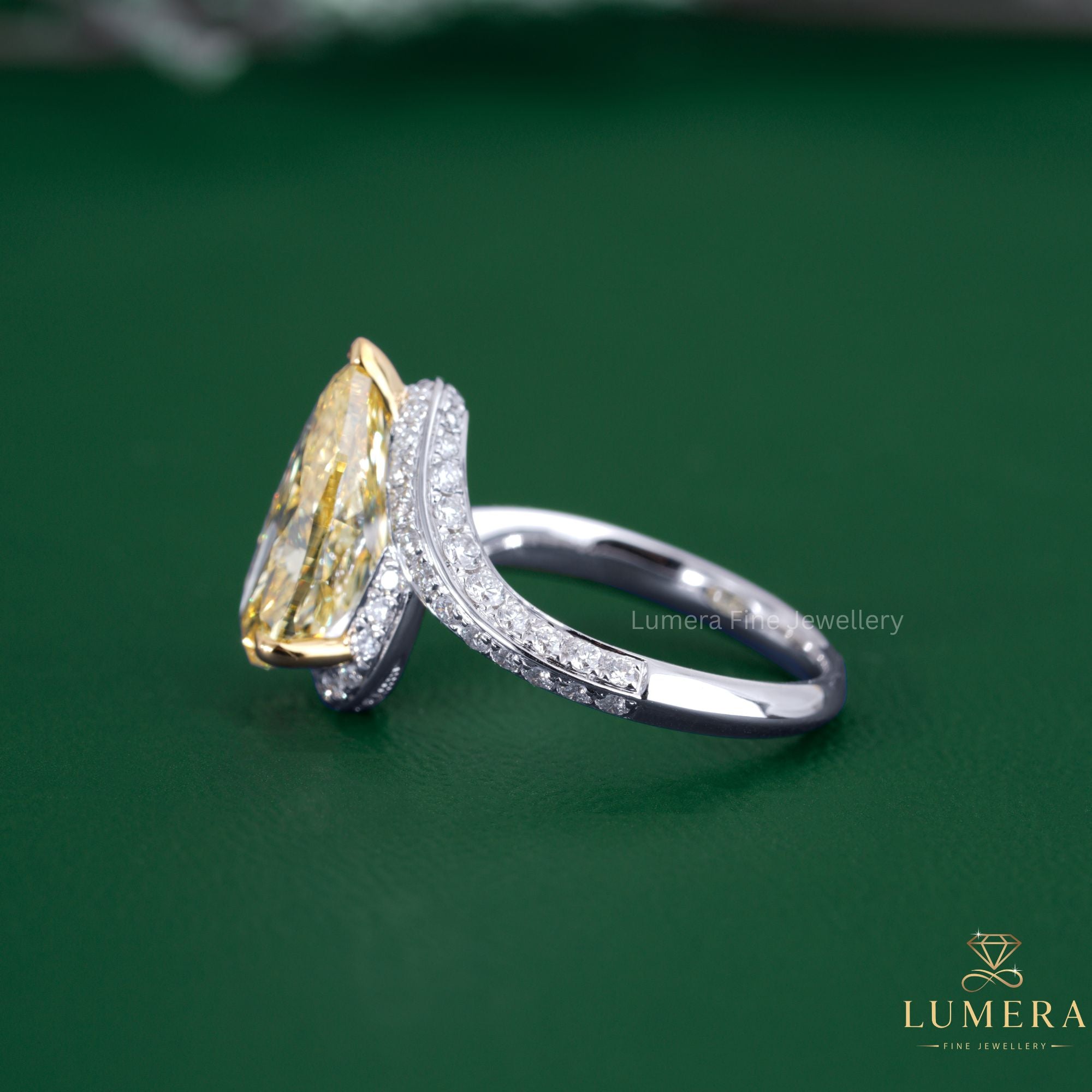 Pear diamond ring with bypass diamond ring.