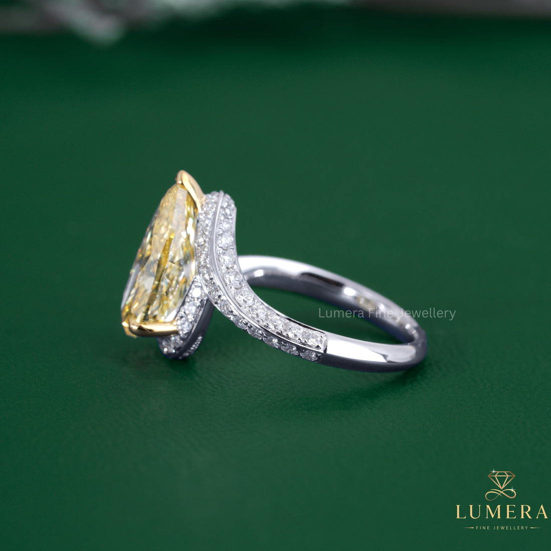 Pear diamond ring with bypass diamond ring.