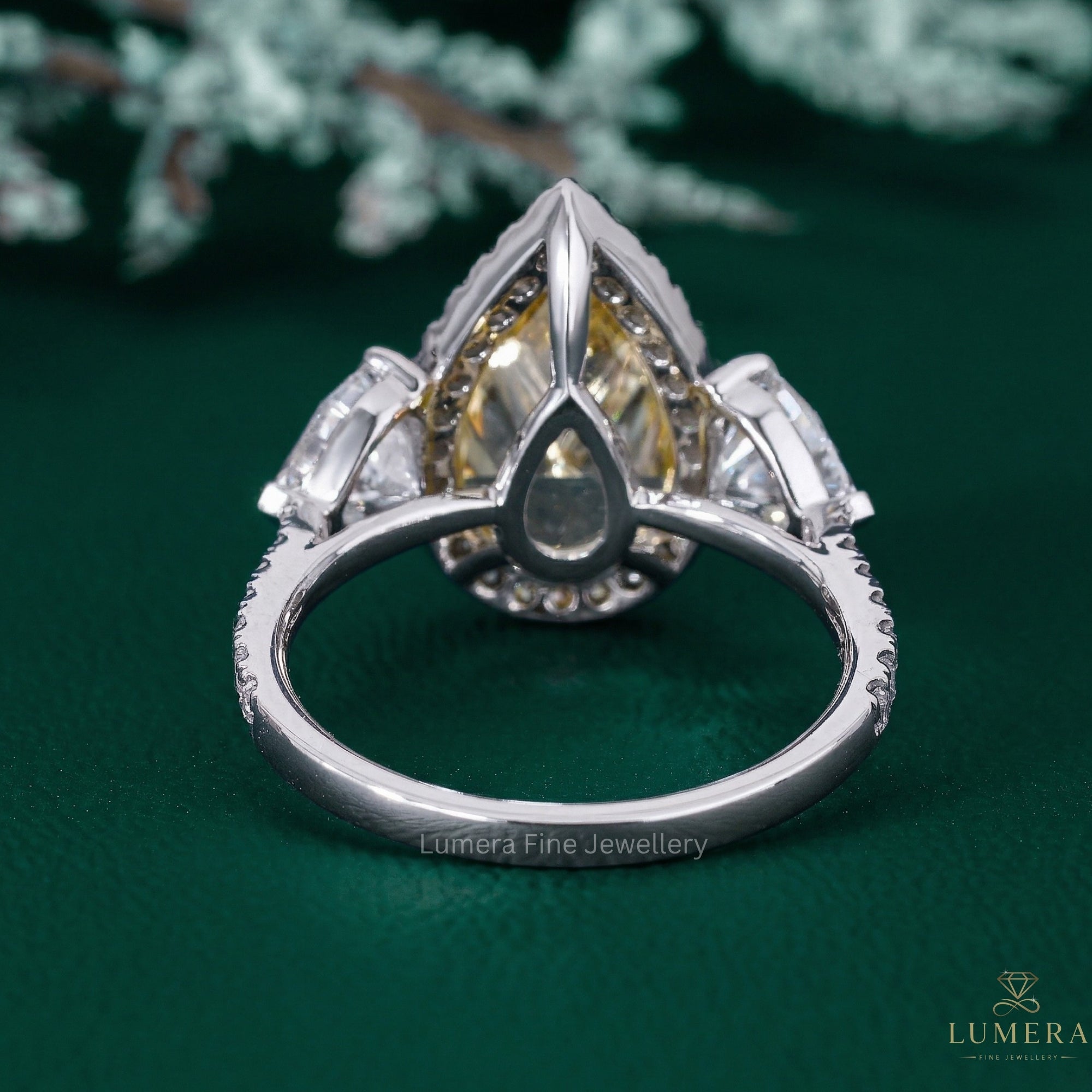 yellow diamond engagement ring with heart side stone.