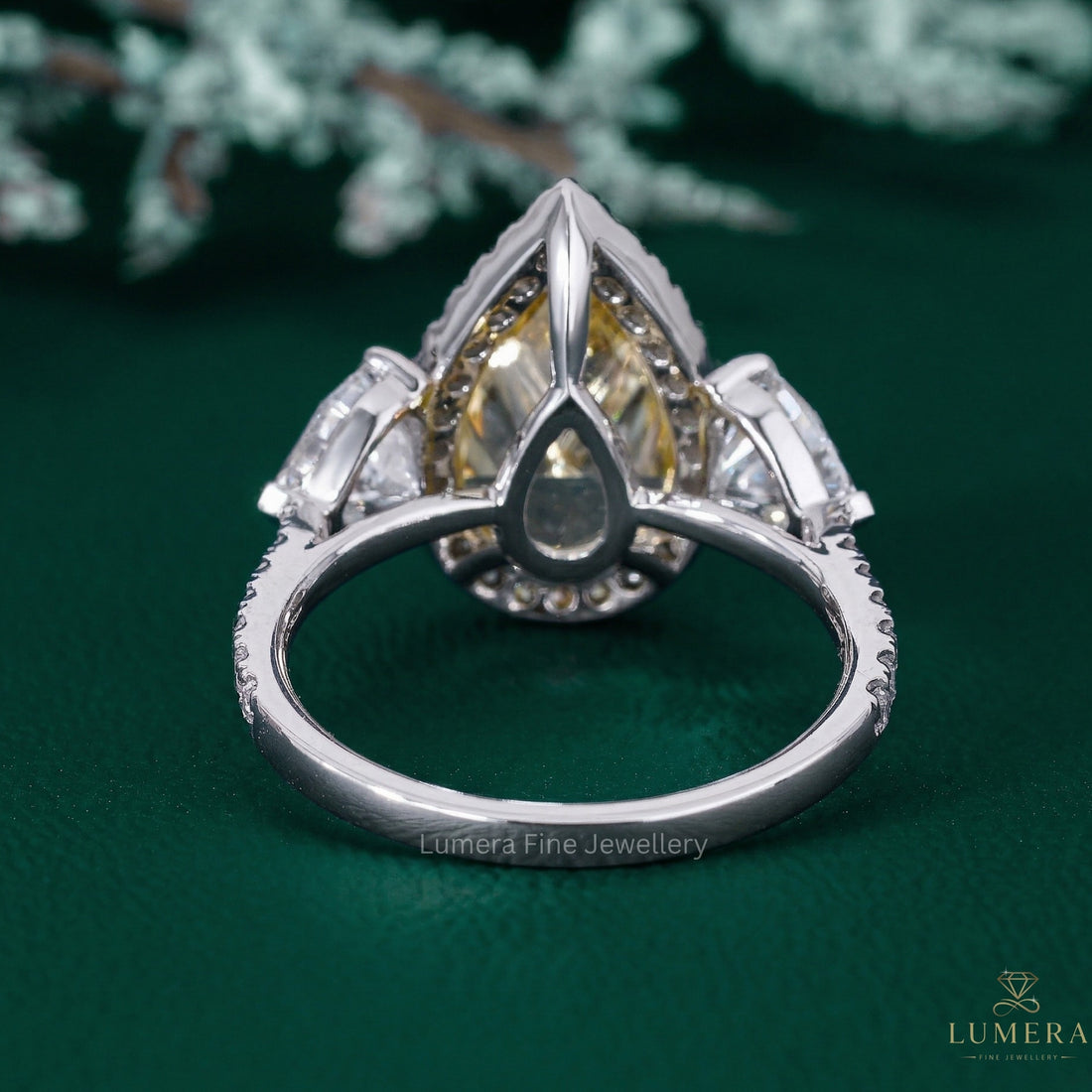 yellow diamond engagement ring with heart side stone.