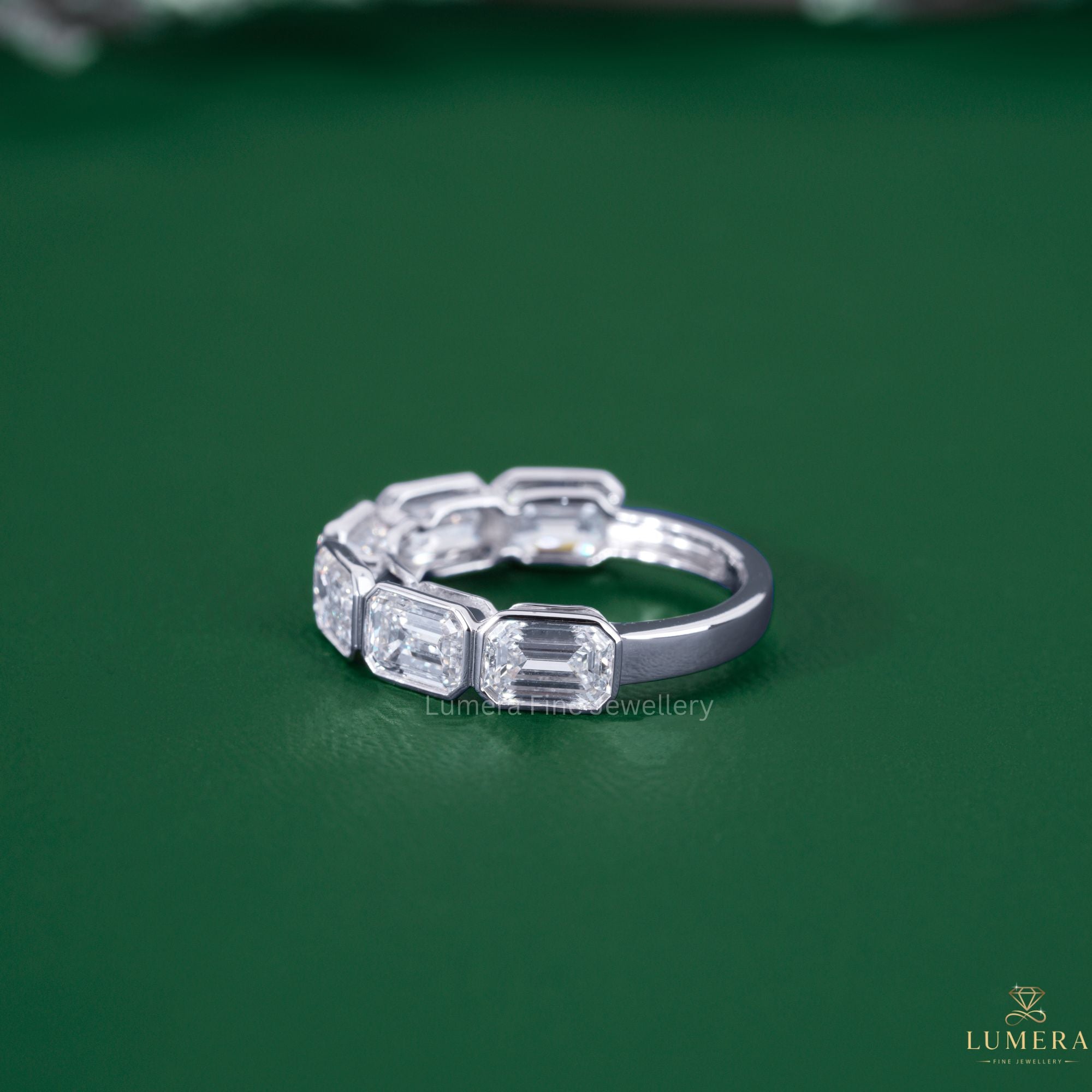 Half eternity wedding band with solid gold band.