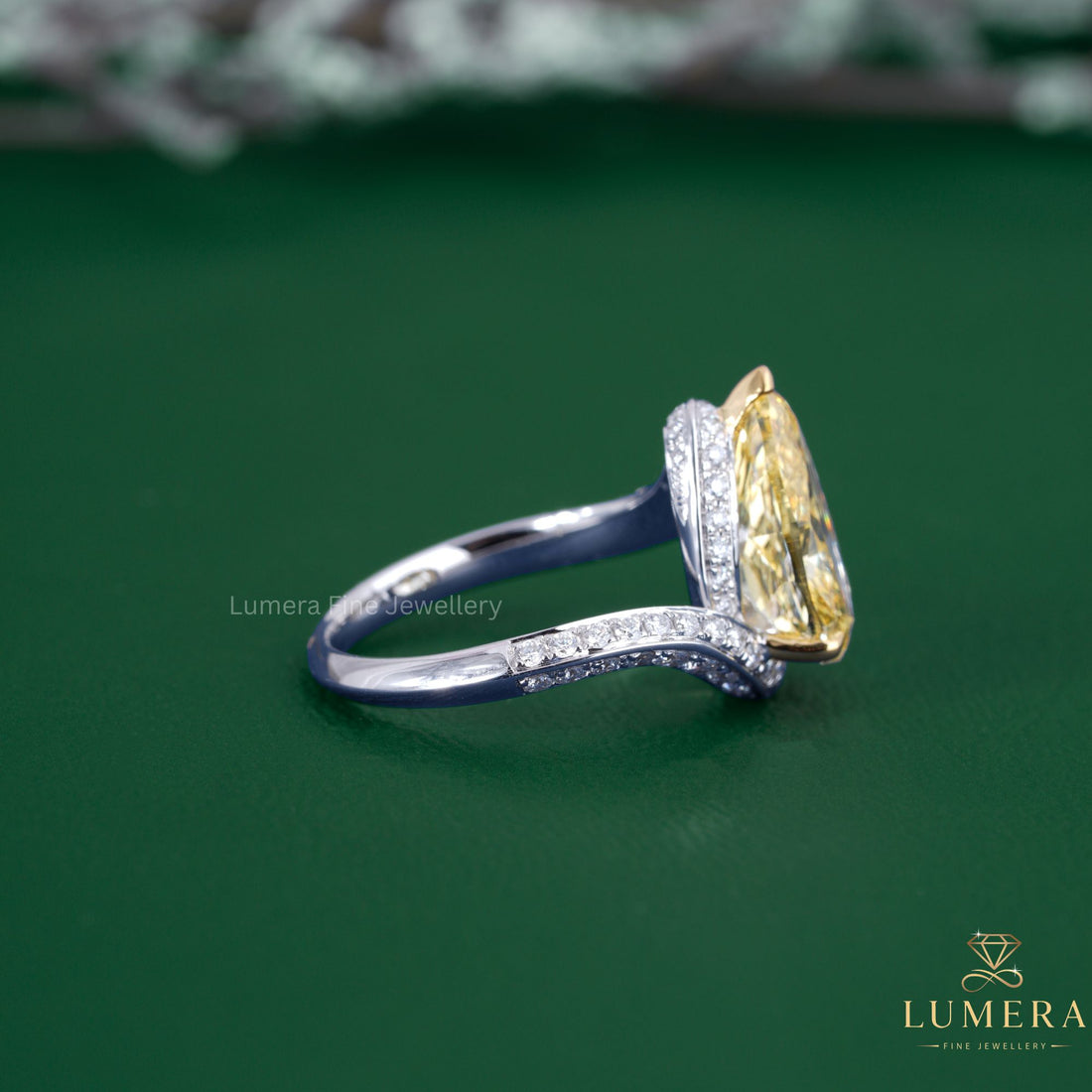 Hidden halo ring with almond diamond ring.