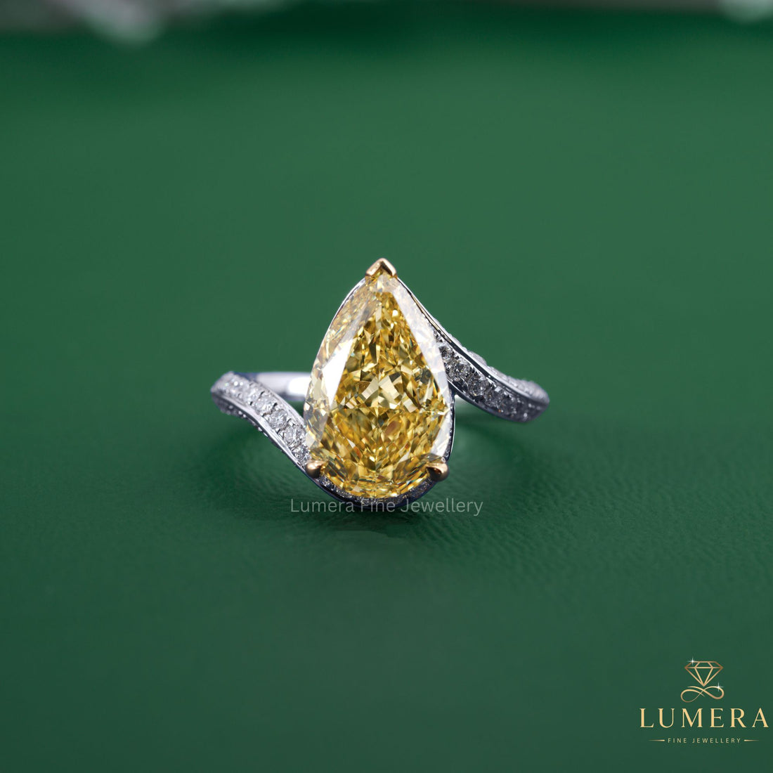 Pear shaped diamond ring with bypass engagement ring.