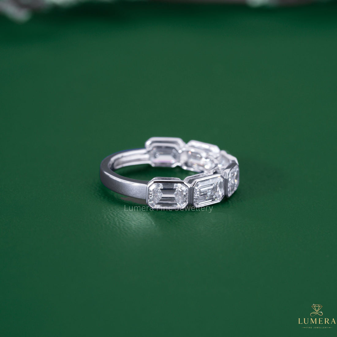 Emerald eternity band with handmade wedding band.
