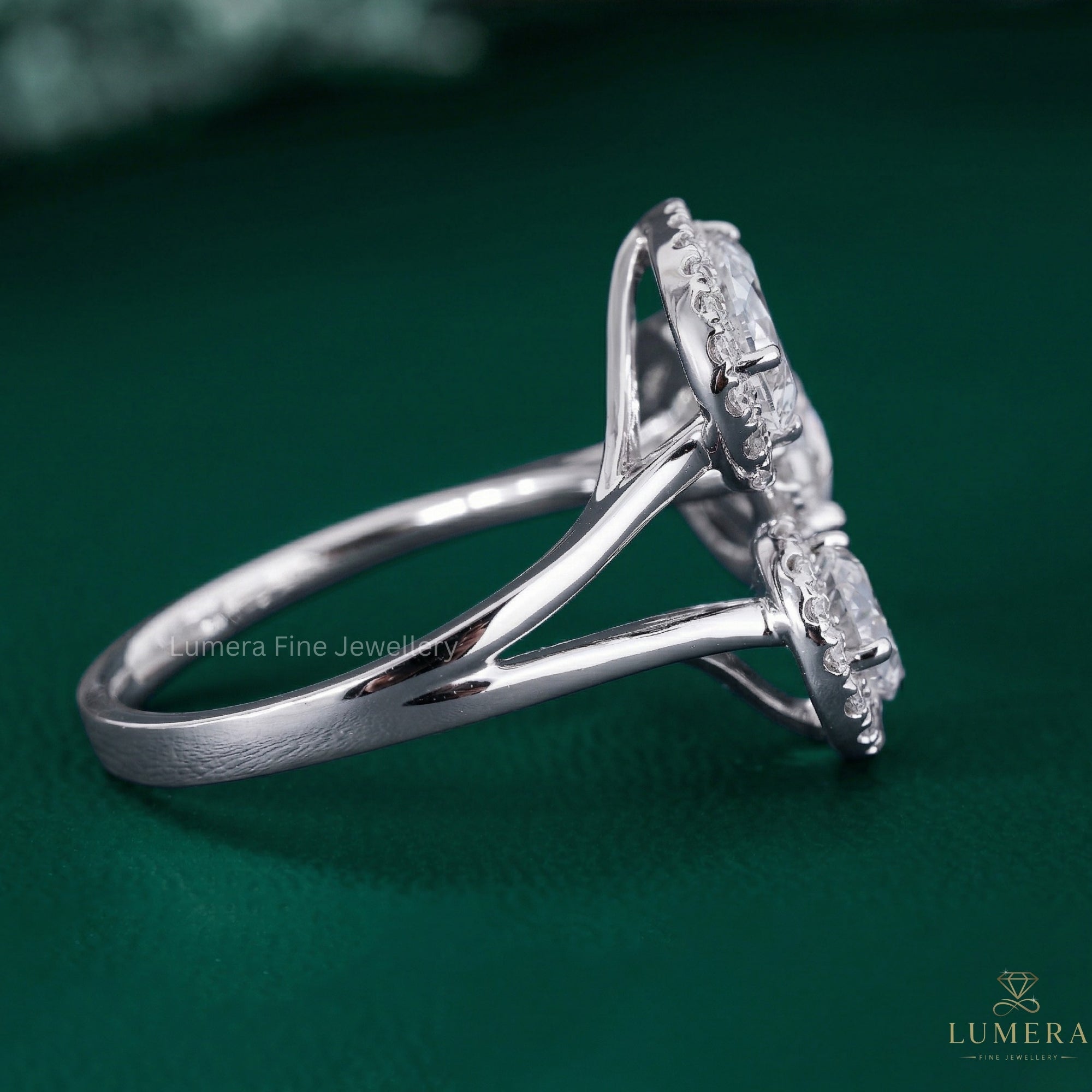 halo engagement ring with cathedral setting ring.