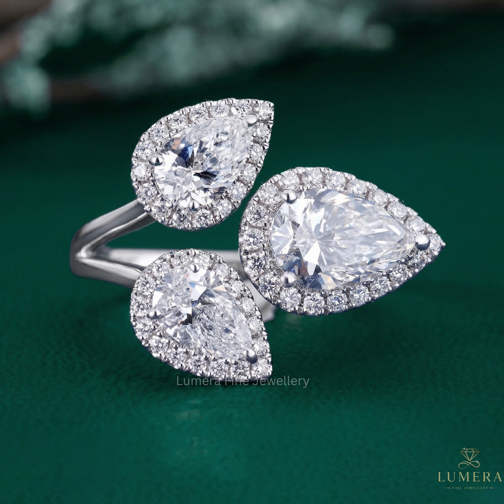 pear cut three stone engagement ring with branch engagement ring.