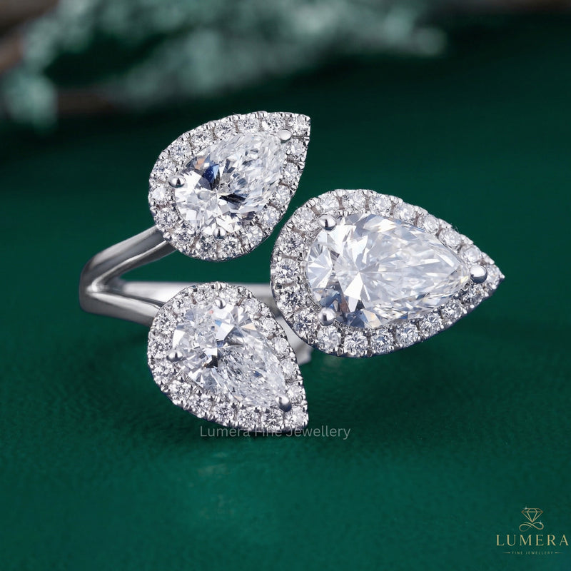 pear cut three stone engagement ring with branch engagement ring.