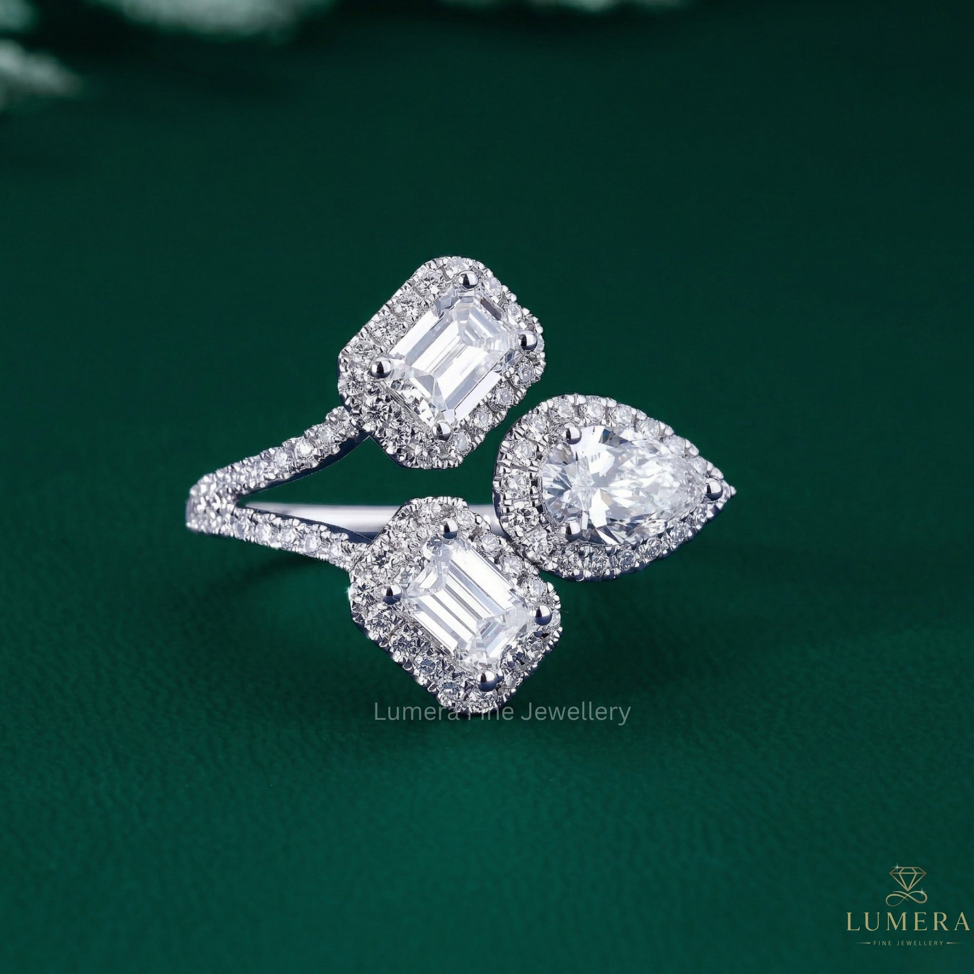 Pear Emerald Diamond Ring with emerald engagement ring.
