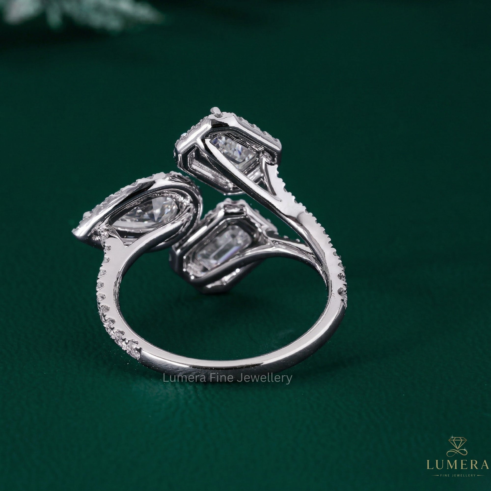 emerald diamond ring with three stone engagement ring.