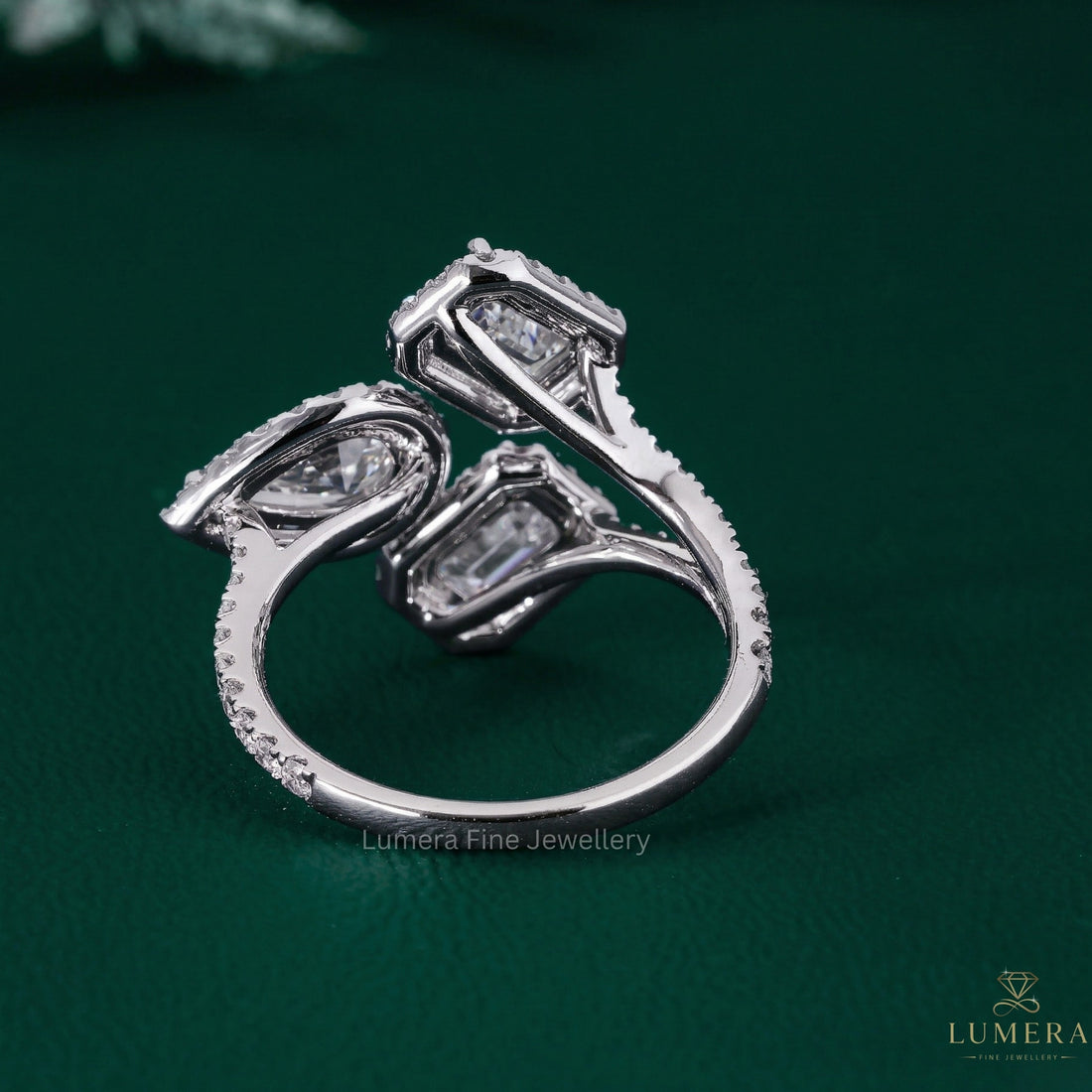 emerald diamond ring with three stone engagement ring.