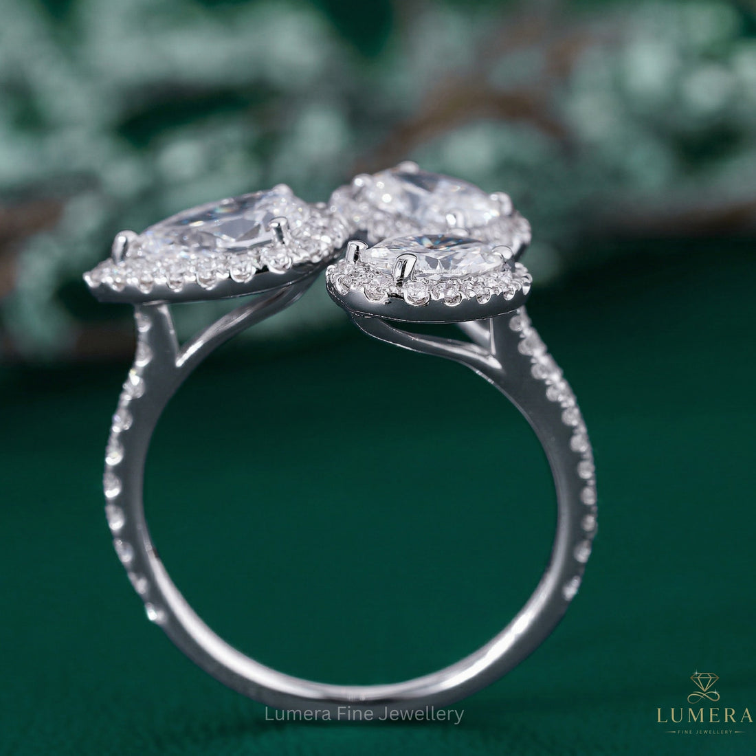 three stone engagement ring with open bypass ring.