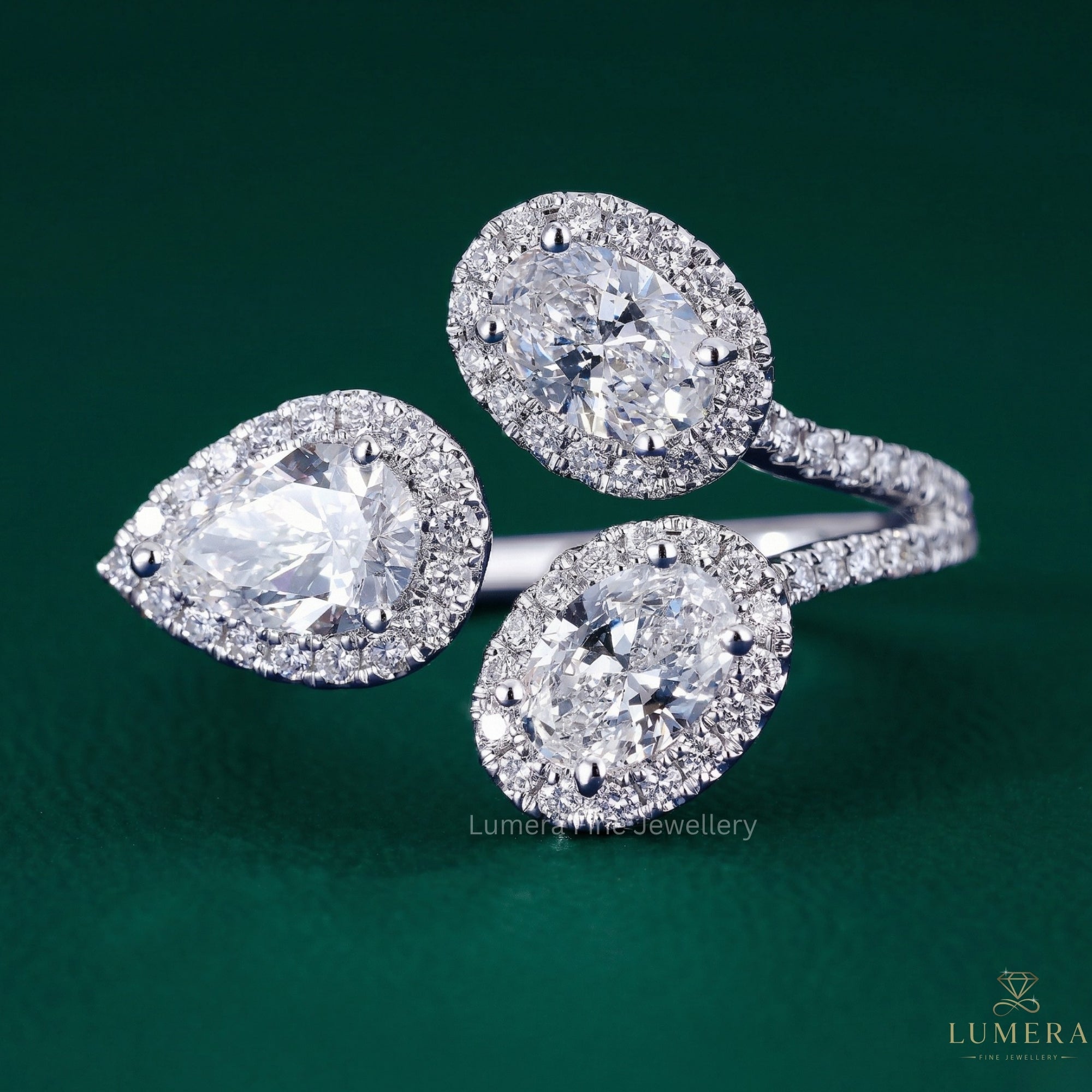 three stone ring with oval cut diamond ring.