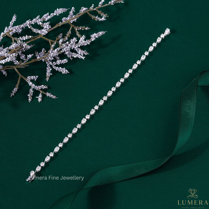 round and pear cut tennis bracelet with pear diamond bracelet.