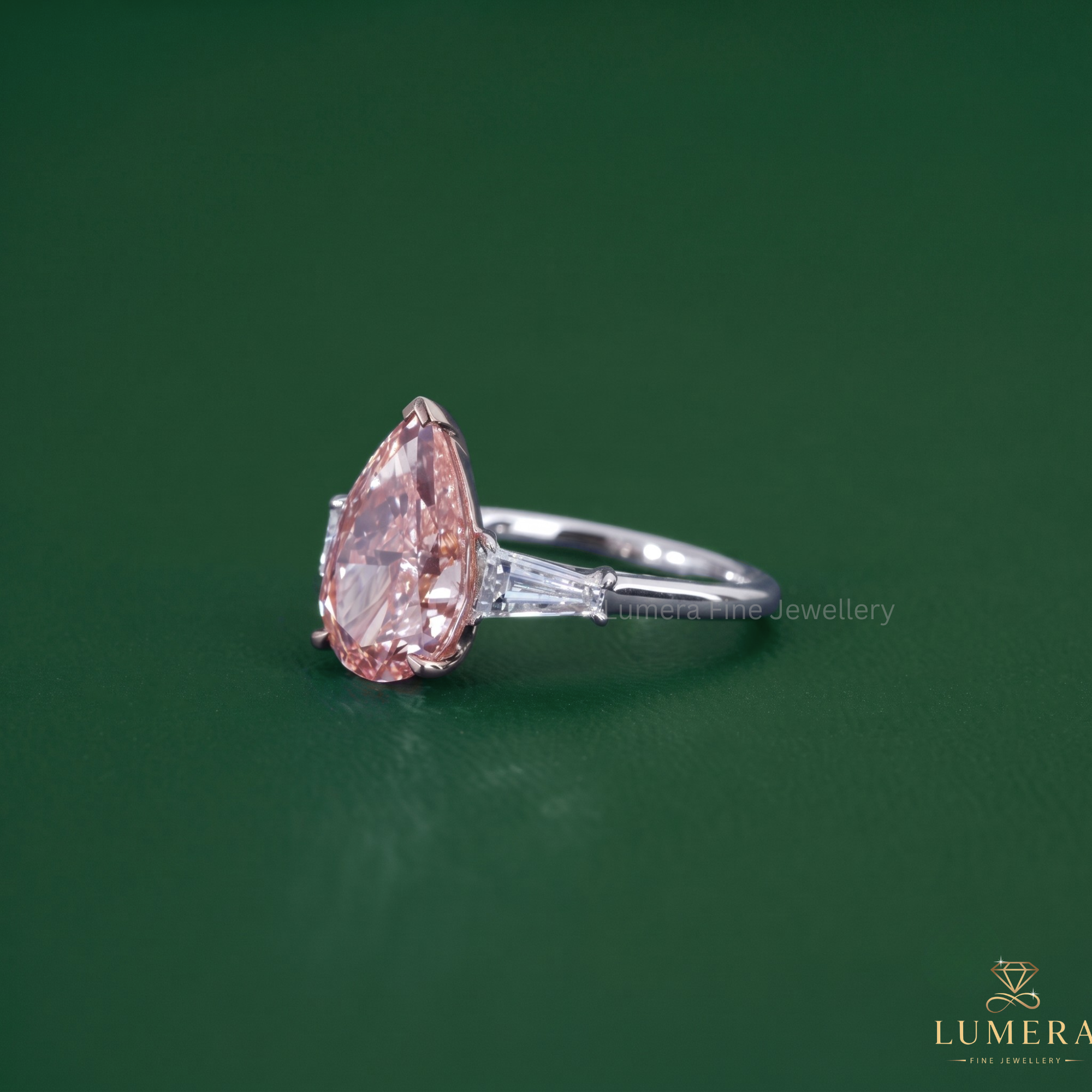 Three stone engagement ring paired with a tapered baguette side stone.